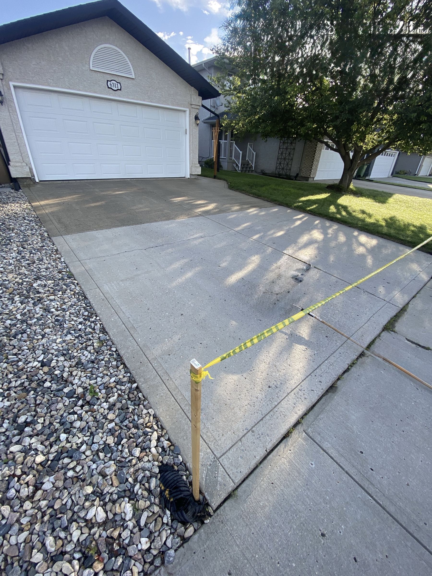 Exposed aggregate driveway and garage