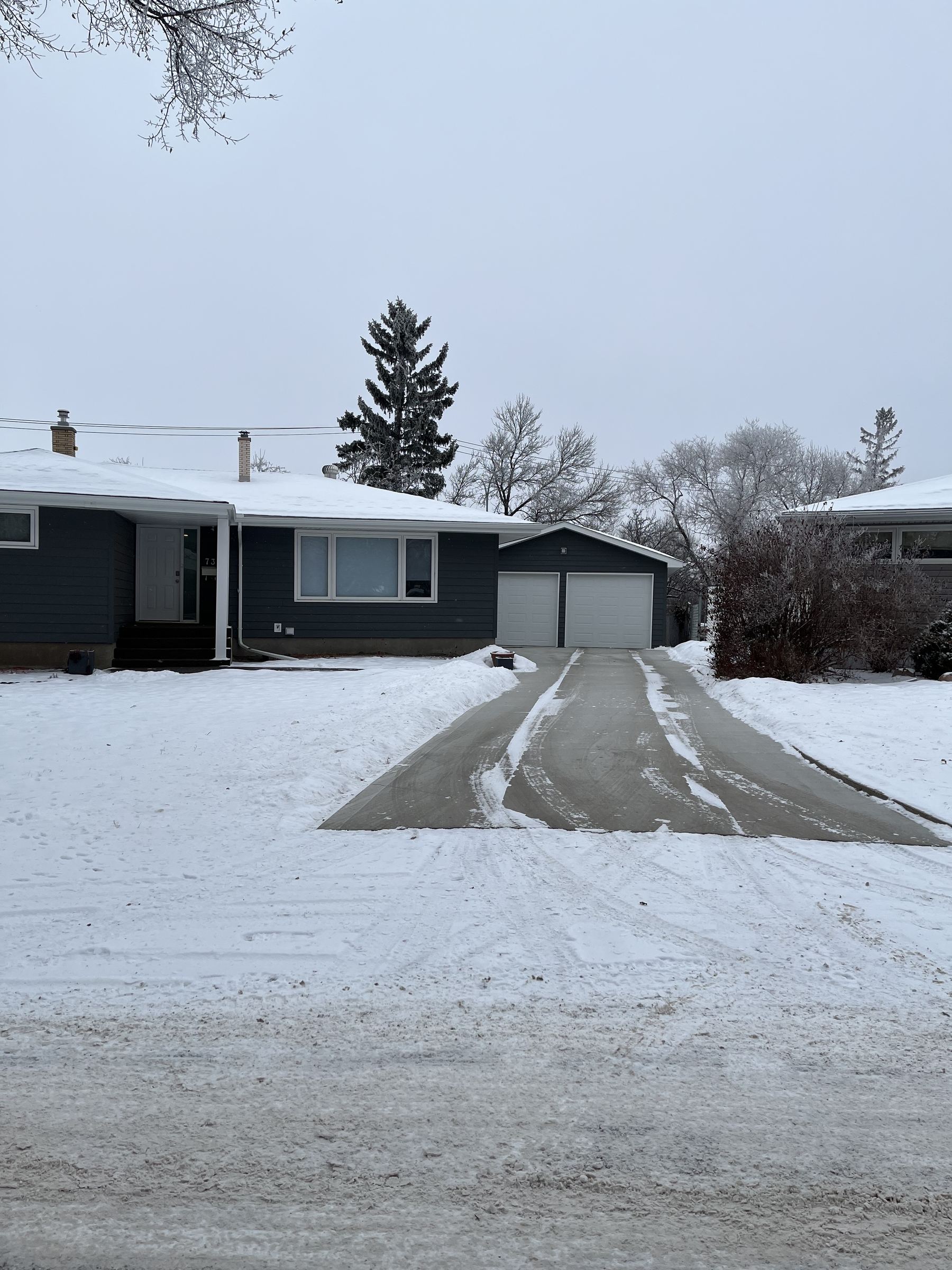 Driveway cleared of snow in winter
