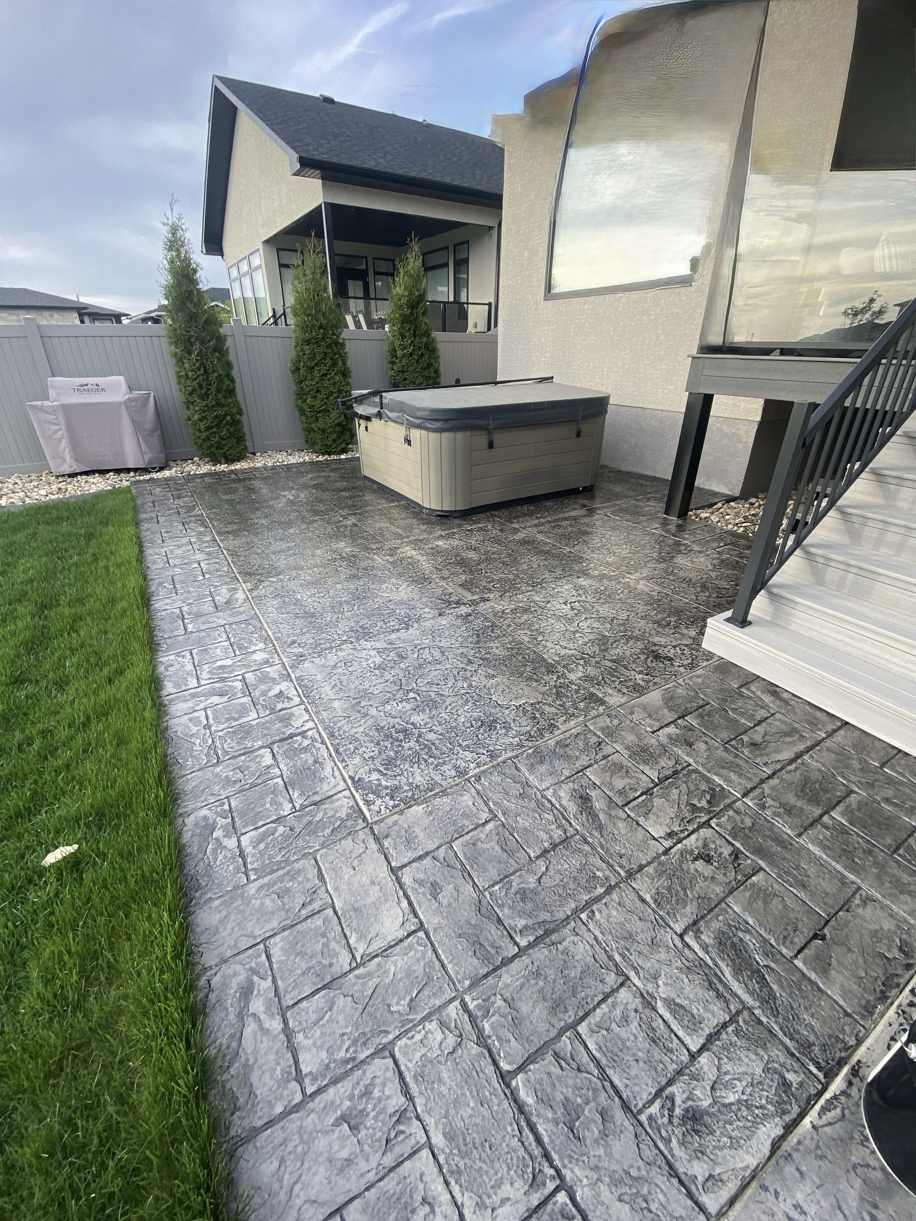 Stamped concrete patio with hot tub area